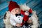 Little baby boy with knitted ladybug hat and pants in a basket