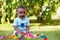 Little baby boy playing in the grass