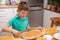 Little baby boy is reaching kitchen knife - danger in kitchen