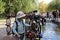 Little baby boy walking considering the decorations on the decorative railing of the fountain in the first square in Novosibirsk