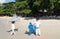 Little baby boys with inflatable toy float playing in the water on summer vacation in a tropical resort. Kids with toy shark and