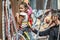 Little baby girl climbs wall grandfather assisting her