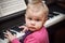 Little baby girl playing music on piano