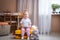 Little baby girl sitting on yellow suitcase baggage luggage, family ready to go for traveling on vacation at home