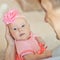 Little baby girl wearing pink knitting dress