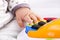 Little baby hand pianist plays on a colorful toy