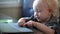 Little baby learning to use laptop computer .