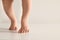 Little baby on light background, closeup on feet