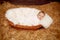 Little baby resting in basket on haystack straw background