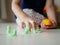 Little baby`s hand playing playdough on the house floor