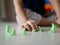 Little baby`s hand playing playdough on the house floor