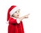 Little Baby in Santa Hat. Christmas Child Points The Finger