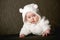 Little baby in white bear costume