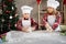 Little bakers kneading dough. Children make cookies and gingerbread at home for Christmas. Children's blog about