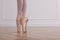 Little ballerina practicing dance moves in studio, closeup of legs. Space for text