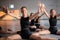 Little ballerinas in ballet studio. Group of happy girls exercising together