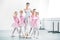 little ballerinas and ballet teacher showing thumbs up and smiling at camera