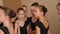 Little ballerinas in a dance school are waiting for the rehearsal to start.