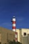 Little beach lighthouse in Ferragudo town, Portugal