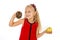 Little beautiful blond child choosing dessert holding unhealthy chocolate donut and apple fruit