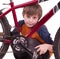 Little beautiful boy with bycicle