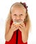 Little beautiful female child with long blonde hair and red dress eating sugar donut