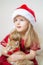 Little Beautiful Girl in Santa Hat Red Party Dress with Little Ginger Kitten Waiting for Christmas and New Year