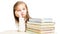 Little beautiful preschooler girl sitting at a table lean on hand over a pile of books tired and sad on a white background