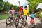 Little bicycle riders enjoying cycling outdoors