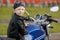 Little biker on road with motorcycle