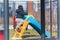 Little biracial boy climbing on the playground slide. Child curiosity concept. Springtime vibes.