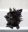 little black spitz dog bathes in the bathroom. wool covered with shampoo foam