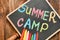 Little blackboard with text SUMMER CAMP chalked