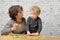 A little blond boy with his grandmother