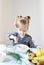 Little Blond Girl Eating Healthy Breakfast Flakes with Milk