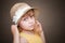 Little blond girl with nice straw hat