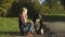 Little blond girl petting a dog