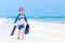 Little blond kid boy having fun on tropical beach of Bora Bora