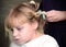 Little blond Russian girl with curlers