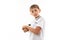 A little blonde boy holds soccer ball, picture isolated on white background