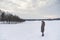 Little blonde caucasian Swedish girl standing outdoor in winter landscape