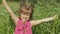 Little blonde child girl in pink dress stay on flower chamomile grass meadow. Bouquet of daisies