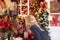 Little blonde girl looking at holiday lights and decorations