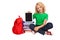 Little blonde girl sitting on the floor near books and bag