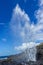 Little blowhole in Kiama on a moody sunny day with water fountain Jervis Bay, Australia