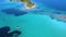 Little boat sailing on blue azure transparent sea with tropic islands. Aerial view