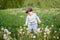 Little boy 1 year old with dandelion. closeup portrait. Spring mood