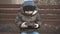 Little boy addictive smartphone sitting on bench in city street. Cute baby boy child with mobile phone on bench outdoor.