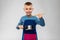 little boy in apron with saucepan cooking food