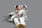 Little boy astronaut in space suit holding helmet and looked at his finger.